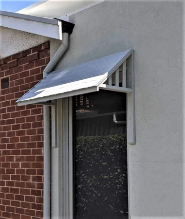 apm_shingle_awning_over_door_152447924